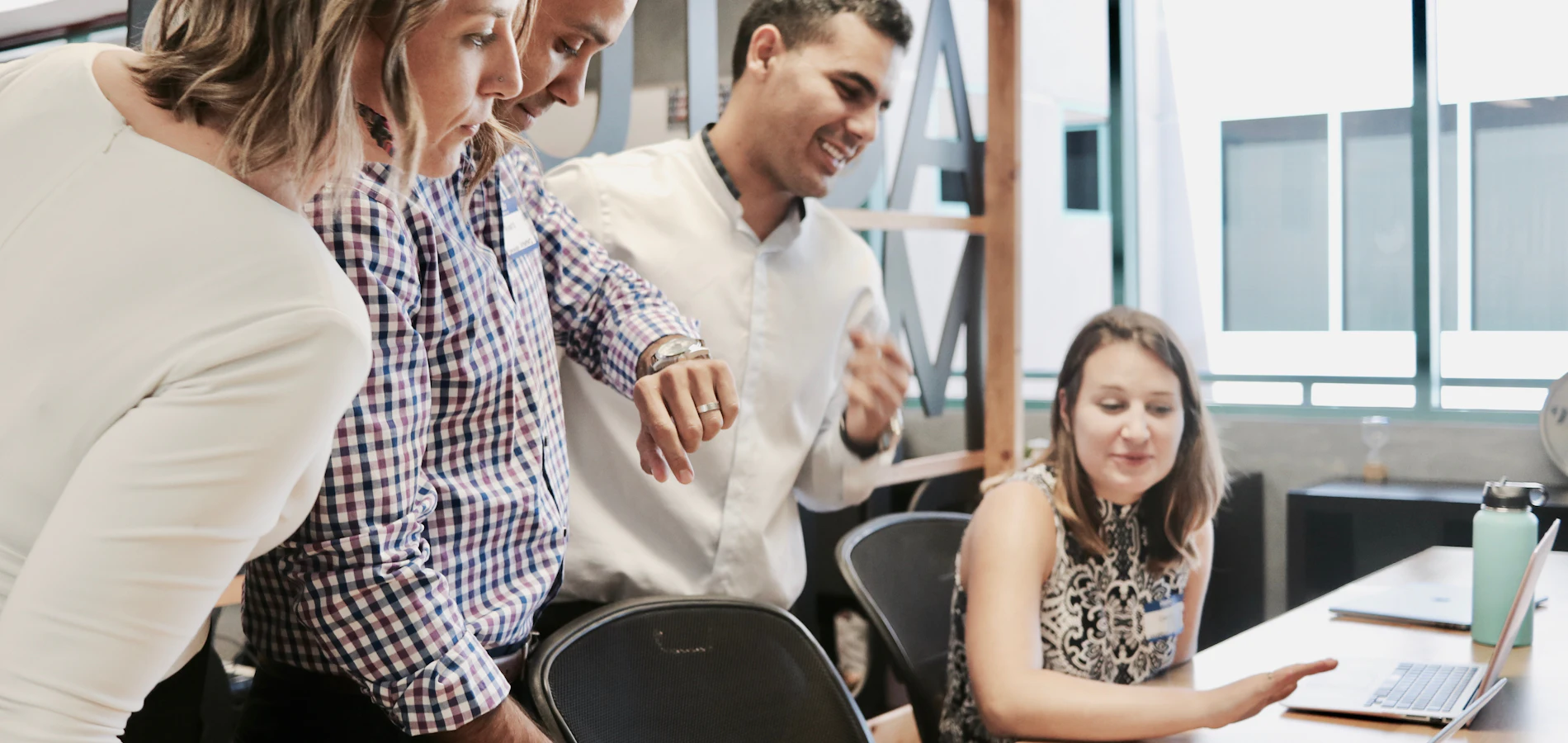 Colleagues gathered around a table during a workplace training session